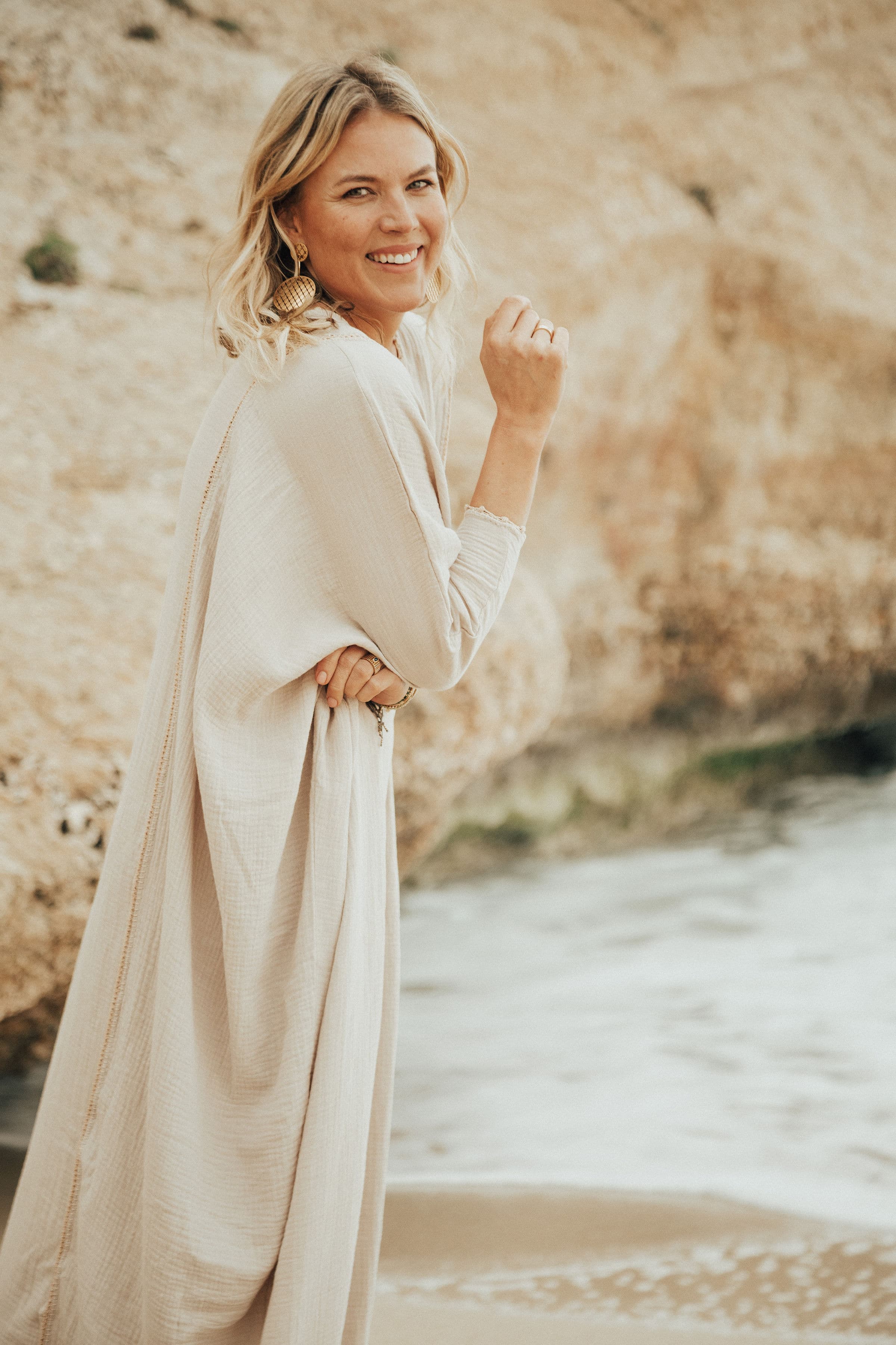 Dr. Emilia Vuorisalmi on the beach, photograph by Olga Poppius