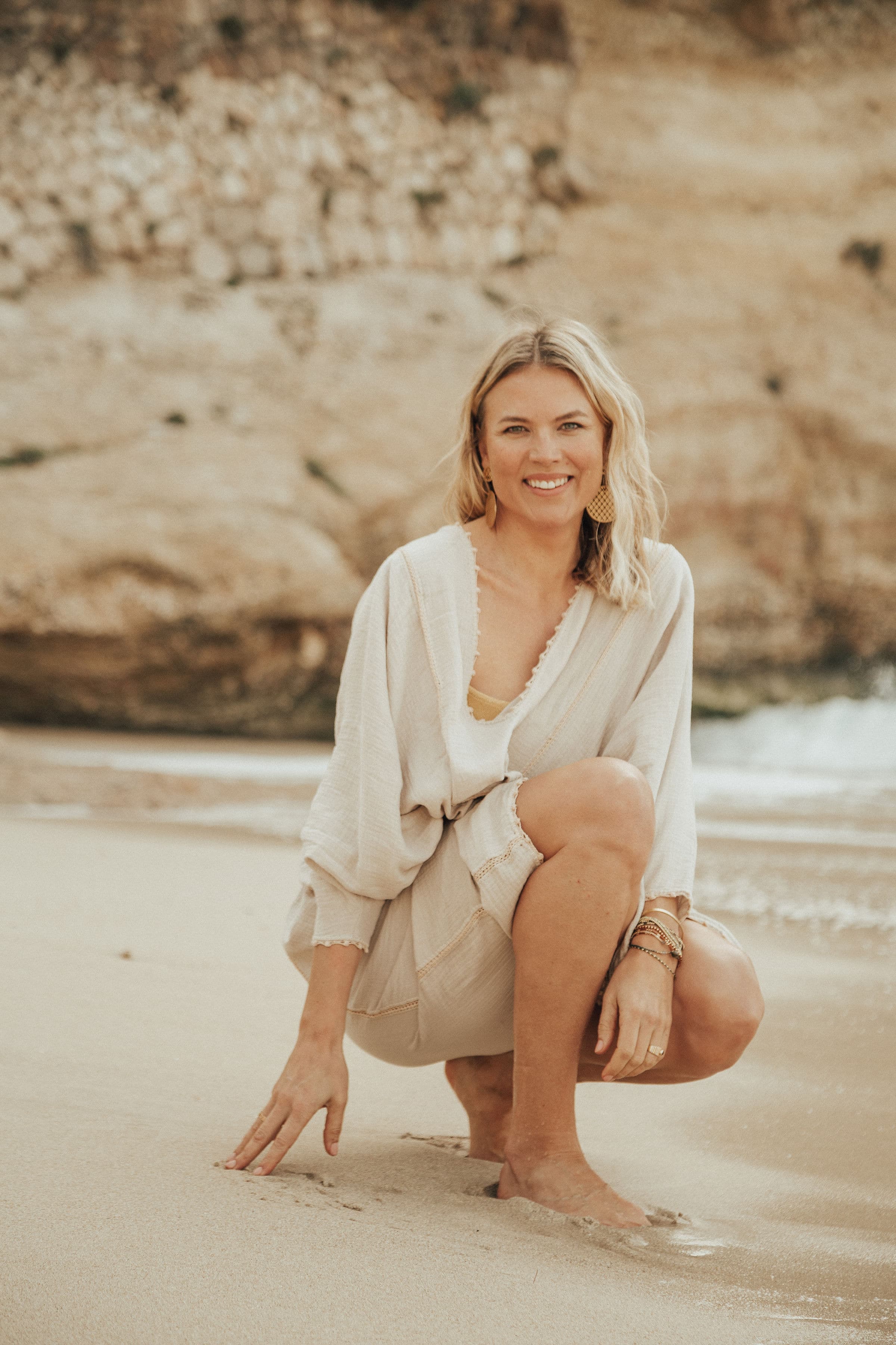 Dr. Emilia Vuorisalmi on the beach, coastal portrait by Olga Poppius