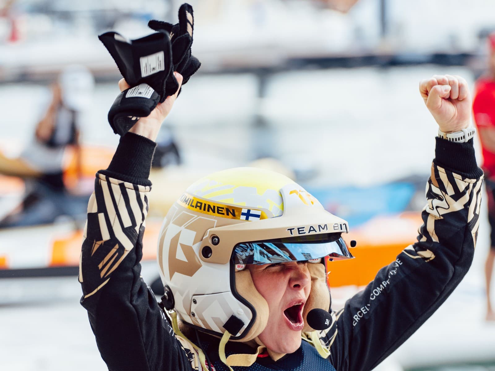 Emma Kimiläinen celebrating an E1 World Championship win in racing helmet and gear