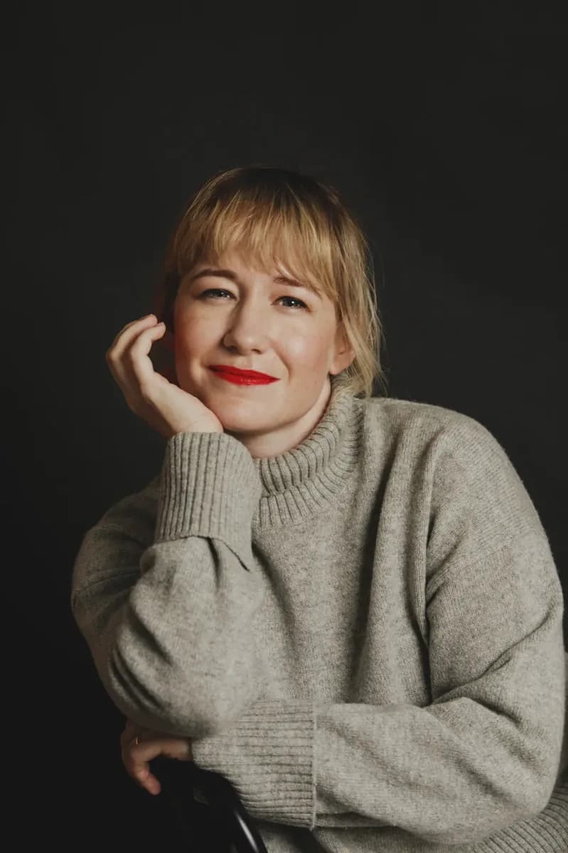 Linda Liukas in a grey sweater looking directly at the camera