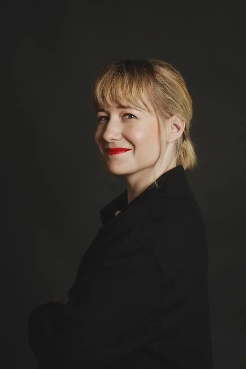 Editorial portrait of Linda Liukas in a black blazer with arms crossed